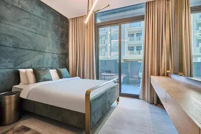 a bedroom with a bed and a large window at Modern Studio Elegant & Comfort in Dubai