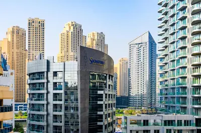 a view of a city with tall buildings at Luxurious 3BR with a pool table at Marina Walk in Dubai