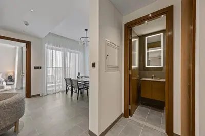 a room with a kitchen and a dining room at Modern Apartment with Balcony and Pool Access in Dubai