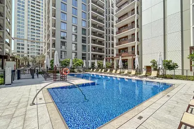 a swimming pool in the middle of a building at Premium Creek Home Steps from the Lagoon in Dubai