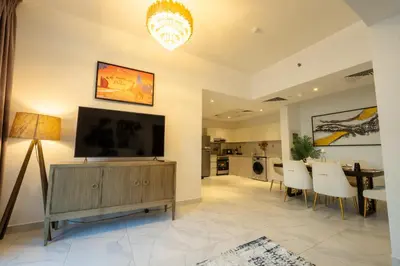 a living room with a flat screen tv on a entertainment center at Business Bay 1BR Burj Khalifa&Canal Views,3Balcony in Dubai