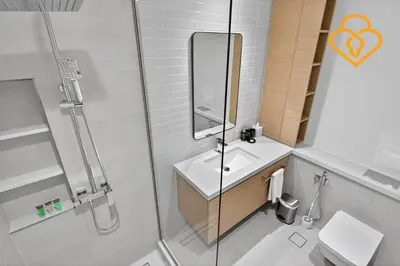 a bathroom with a shower and a sink and a toilet at Keysplease Beautiful 2 BR Creek Crescent Water View, Harbour in Dubai