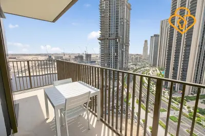 a balcony with a table and a view of a city at Keysplease Beautiful 2 BR Creek Crescent Water View, Harbour in Dubai