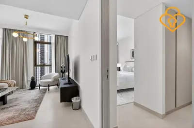 a living room with a bed and a room with a room at Keysplease Beautiful 2 BR Creek Crescent Water View, Harbour in Dubai