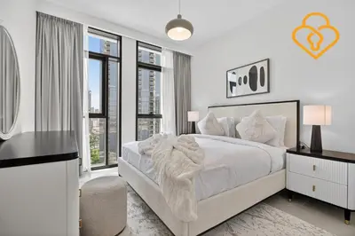 a white bedroom with a large bed and windows at Keysplease Beautiful 2 BR Creek Crescent Water View, Harbour in Dubai