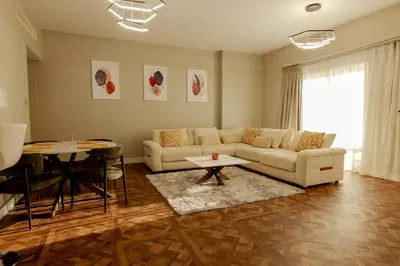 a living room with a couch and a table at Full Sea View Luxury Large 1 BR in JBR in Dubai