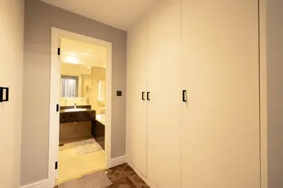 a room with white cabinets and a bathroom at Full Sea View Luxury Large 1 BR in JBR in Dubai