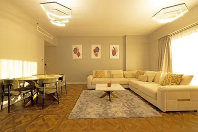 a living room with a couch and a table at Full Sea View Luxury Large 1 BR in JBR in Dubai