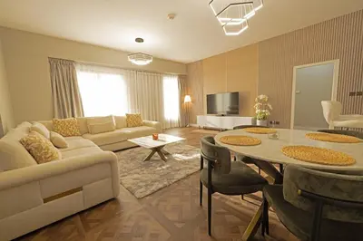 a living room with a couch and a table at Full Sea View Luxury Large 1 BR in JBR in Dubai