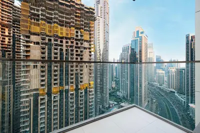 a view of a city skyline from a skyscraper at Two Identical Apartments - Same Building in Dubai