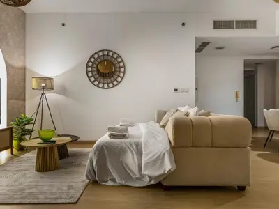 a living room with a couch and a table at Beachfront 2BR Dubai Eye & Sea View Beach Access in Dubai