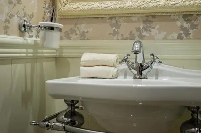 a bathroom with a sink and a towel at Penthouse four bedroom with two large chillout terraces in Dubai