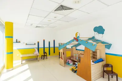 a room with a playroom with a play equipment at Spacious Apartment with Excellent Facilities in Dubai