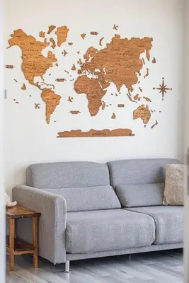 a living room with a couch and a map of the world at Spacious Apartment with Excellent Facilities in Dubai