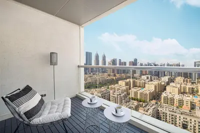 a balcony with a view of a city at Spacious Apartment with Excellent Facilities in Dubai