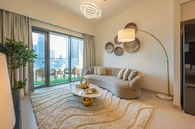 a living room with a couch and a table at Stunning Burj Khalifa View! Steps to Dubai Mall in Dubai