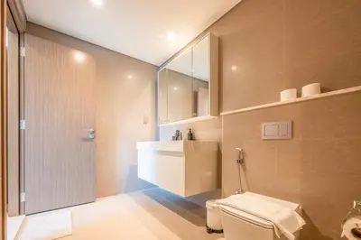 a bathroom with a toilet and a sink at Stunning Burj Khalifa View! Steps to Dubai Mall in Dubai