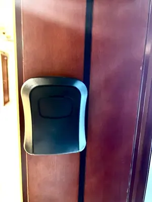 a blue chair sitting on the side of a door at Spacious Modern Studio In downtown in Dubai