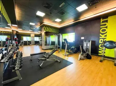 a gym with several treadmills and exercise machines at Luxury Renovated 1BR w Full Sea View in Dubai