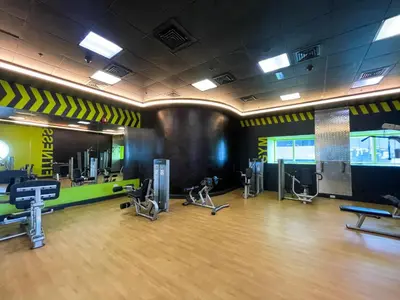 a gym with treadmills and exercise equipment in a room at harborfront elegance dubai in Dubai