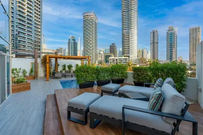 a balcony with a view of a city skyline at Private villa in Marina with private pool!!! in Dubai