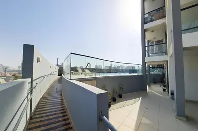 a balcony of a building with a view of the city at Work & Relax Above the City- JVC Perfect Stay in Dubai