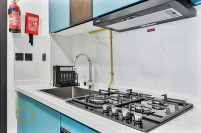 a kitchen with a stove and a sink at Bookable Stylish Dubai escape with private pool in Dubai
