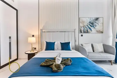 a bedroom with a bed with a towel on it at Bookable Stylish Dubai escape with private pool in Dubai