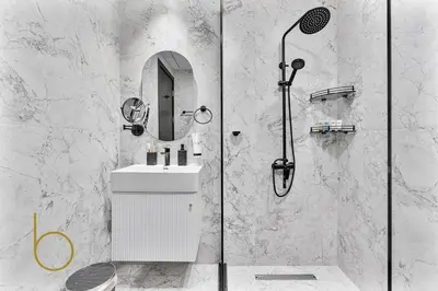 a bathroom with a shower with a sink and a mirror at Bookable Stylish Dubai escape with private pool in Dubai