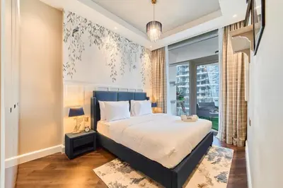a bedroom with a bed and a large window at FAM Living Contemporary 1BR Apartment Urban Oasis in Dubai