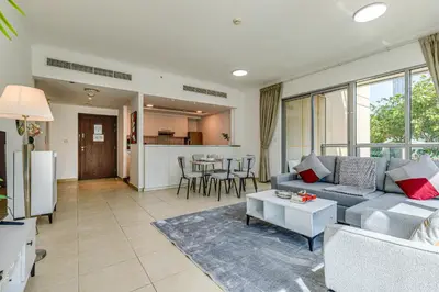 a living room with a couch and a table at Residences 1 Tower 5 E2 - 2BR Apartment - Allsopp & Allsopp in Dubai