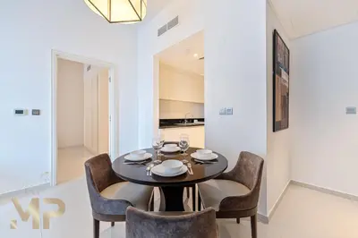 a dining room with a table and chairs at Marcopolo - Experience modern living in Business Bay Dubai in Dubai