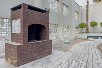 a brick fireplace in front of a building at Marcopolo - Experience modern living in Business Bay Dubai in Dubai