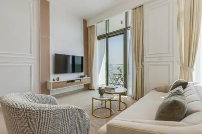 a living room with a couch and chairs and a tv at Fawad Azizi Residence, Al Jaddaf- 1BR - Allsopp & Allsopp in Dubai