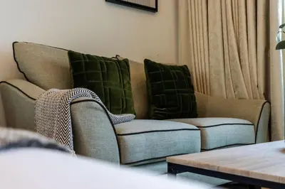 a living room with a couch and two chairs at Bright Studio in Binghatti Canal in Dubai