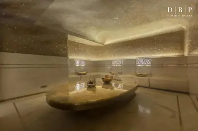 a room with a table in the middle of a room at FIVE Palm Jumeirah 3BR plus Luxury Lifestyle Residence in Dubai