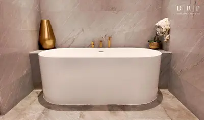 a white tub in a bathroom with a gold vase at FIVE Palm Jumeirah 3BR plus Luxury Lifestyle Residence in Dubai