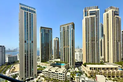a group of tall buildings in a city at Luxury 1 Bed Apt in Palace, Dubai Creek Harbour in Dubai