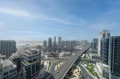 an aerial view of a city with a highway at Stylish and Spacious Downtown Studio in Dubai