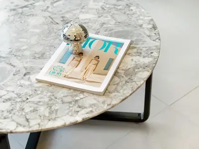 a table with a magazine on top of it at Iconic Burj and Fountain View 2BR Downtown in Dubai