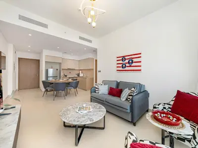 a living room with a couch and a table at Iconic Burj and Fountain View 2BR Downtown in Dubai