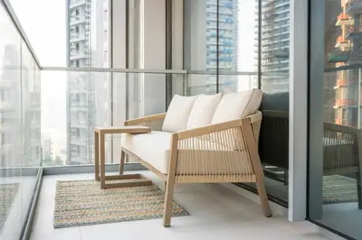 a chair on a balcony with a view of a city at New 2BR Luxe Vida Dubai Mall Direct Access in Dubai