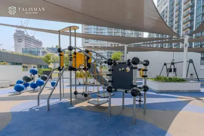 a playground in a building with a gym at Luxury 1BR Burj Khalifa & Flamingo Sanctuary Views in Dubai