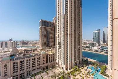 an aerial view of a city with tall buildings at Luxury Leisure Massive Pool Oasis in Amna Tower in Dubai