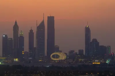 a skyline of a city at dusk with at Luxury 1 Bedroom with Pool Dubai Frame Museum View in Dubai