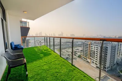 a balcony with a chair and a view of the city at Luxury 1 Bedroom with Pool Dubai Frame Museum View in Dubai