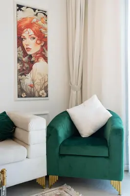 a green chair in a living room with a painting at Luxury 1 Bedroom with Pool Dubai Frame Museum View in Dubai