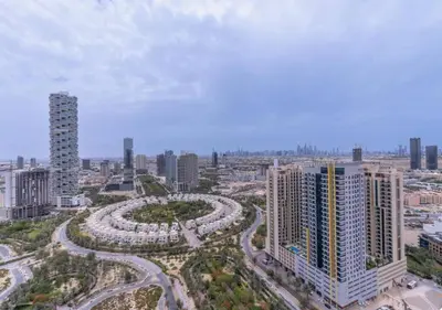 an aerial view of a city with tall buildings at City Forest Studio in JVC in Dubai