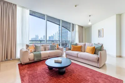a living room with two couches and a table at Located Near Museum of the Future and Index Mall, Just a few Minutes Drive from Burj Khalifa and Dubai Mall - Sky Gardens, DIFC by Deluxe Holiday Homes in Dubai