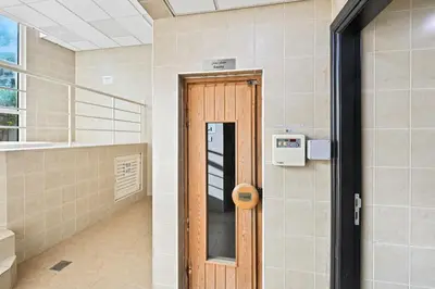 a door in a room with a stair case at Yacht Bay Tower 1min to Metro, Tram and 5min to Marina in Dubai